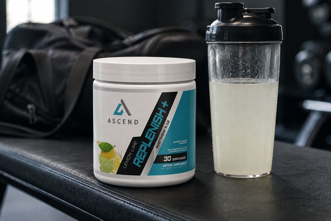Replenish+ tub on a gym bench beside a mixed shaker.